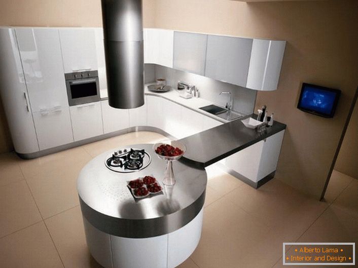 Die Küche im Stil des Minimalismus unterscheidet sich durch klar abgegrenzte geometrische Formen. Dieses Projekt zeichnet sich durch einen runden Esstisch aus, kombiniert mit einer Arbeitsplatte mit einer Küchengarnitur.