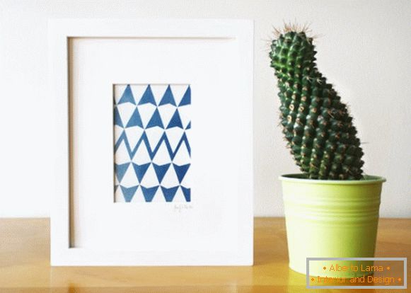 Ein Bild mit einem geometrischen Druck und einem Kaktus
