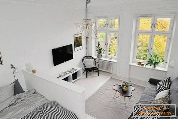 Ein-Zimmer-Wohnung im skandinavischen Stil - Wohnzimmer und Schlafzimmer